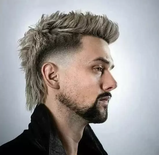 Full picture of a man rocking a bleached burst fade mullet