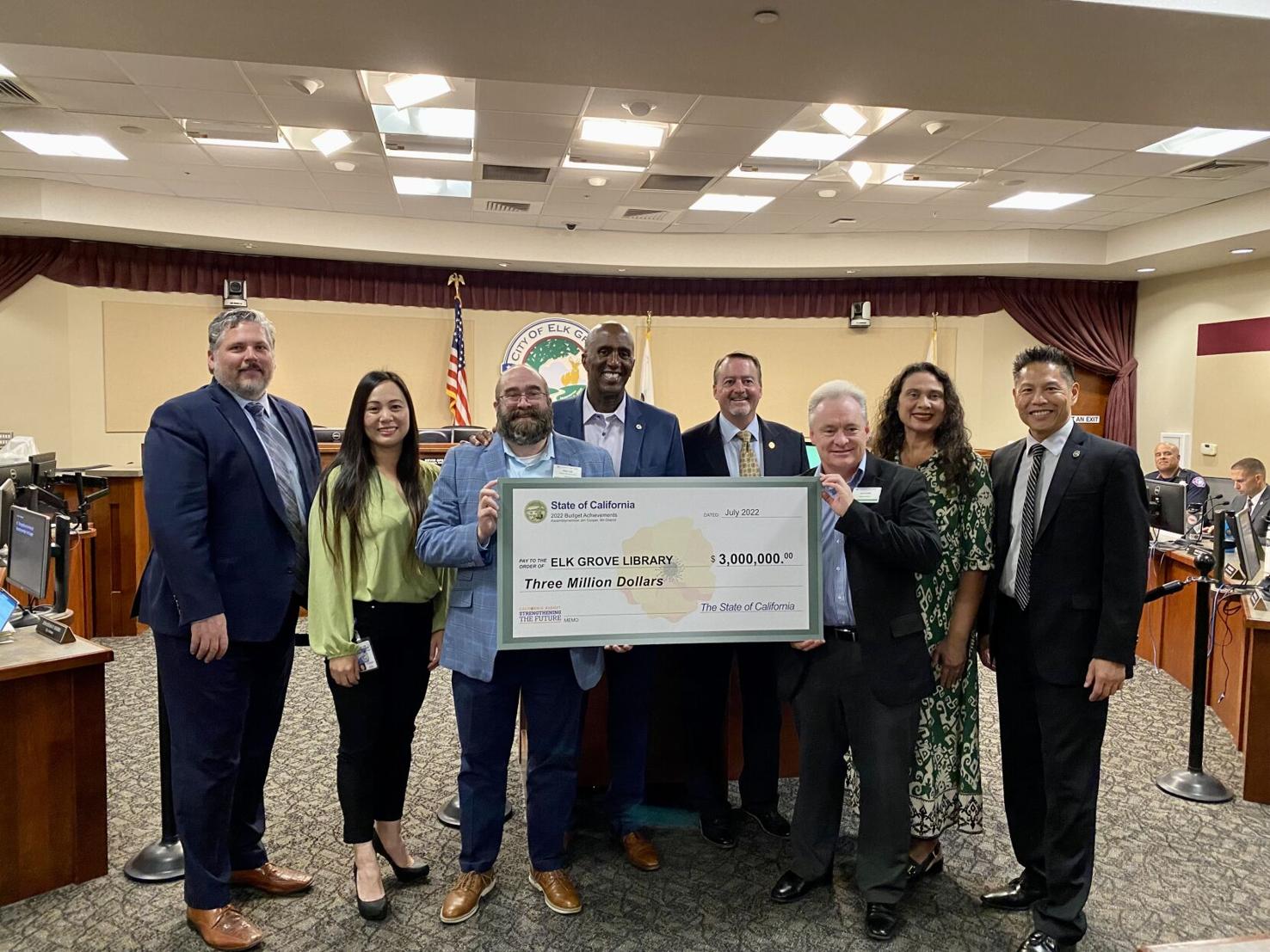 Former Councilmember Jim Cooper presents a $3 million check to the city of Elk Grove on Oct. 12. Community activist Dorothy Benjamin says no plans for an Oak Park library have materialized since the McClatchy Park Library’s closure in 1993.