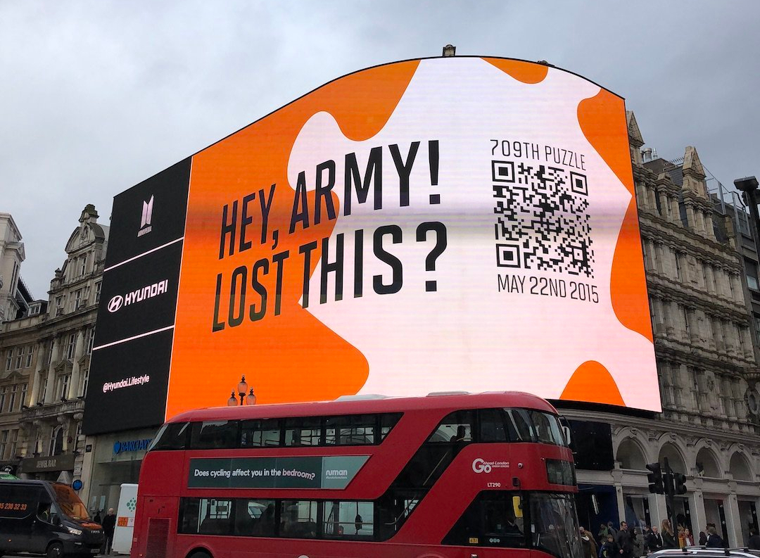 Armypedia project's giant digital billboard, saying "Hey, Army! Lost this?" with a QR code indicating 709th puzzle and the date May 22nd, 2015