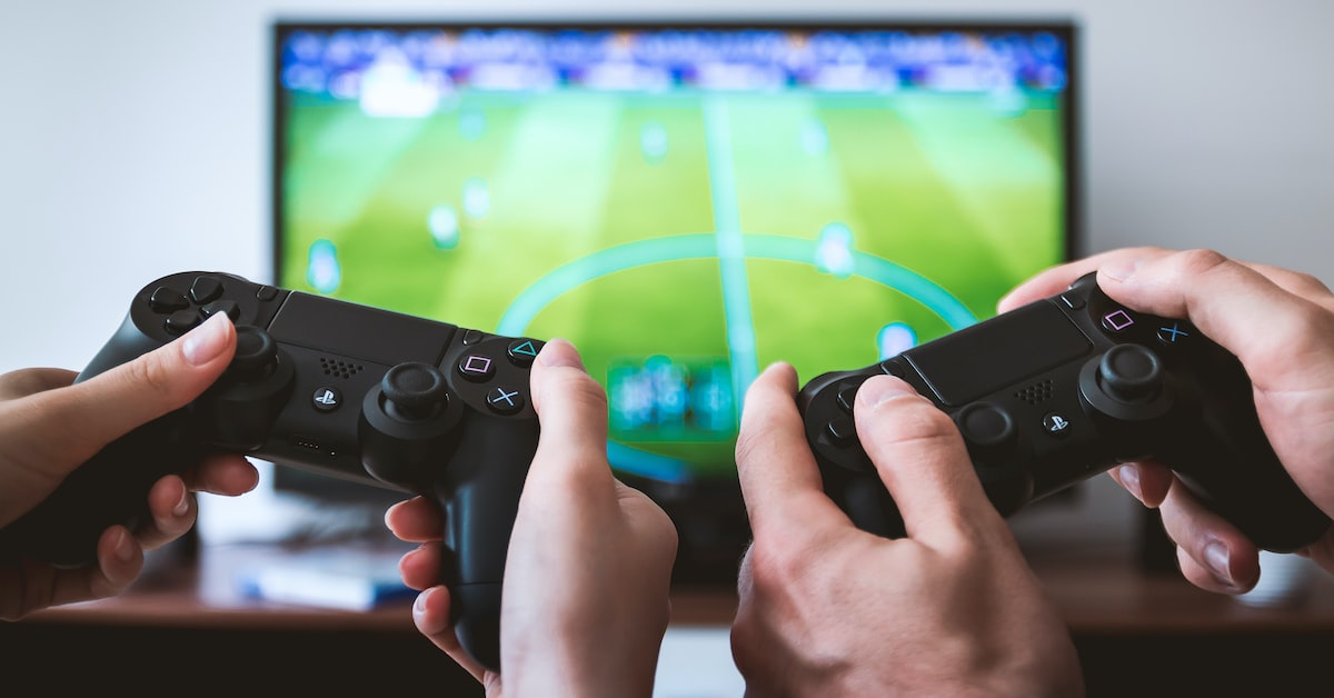Two game controllers on the background of TV