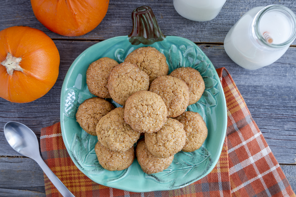 A decorative fall tray holding pumpkin spiced oatmeal cookies