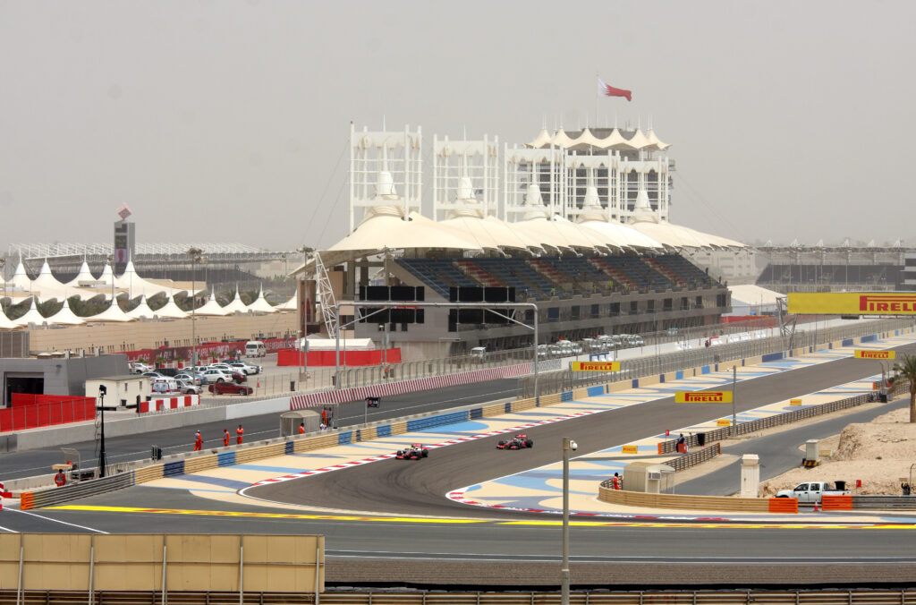 Formula 1 cars racing during Friday practice session in 2012 Formula 1 Gulf Air Bahrain Grand Prix on April 20, 2012, in Shakir, Bahrain