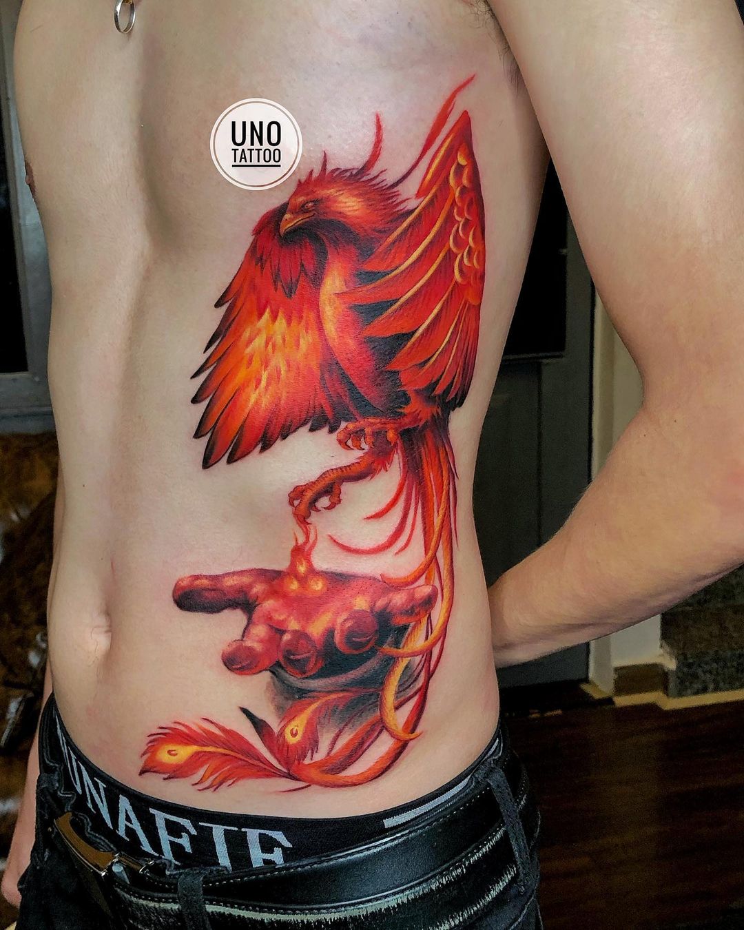 Phoenix With Hand Tattoo
