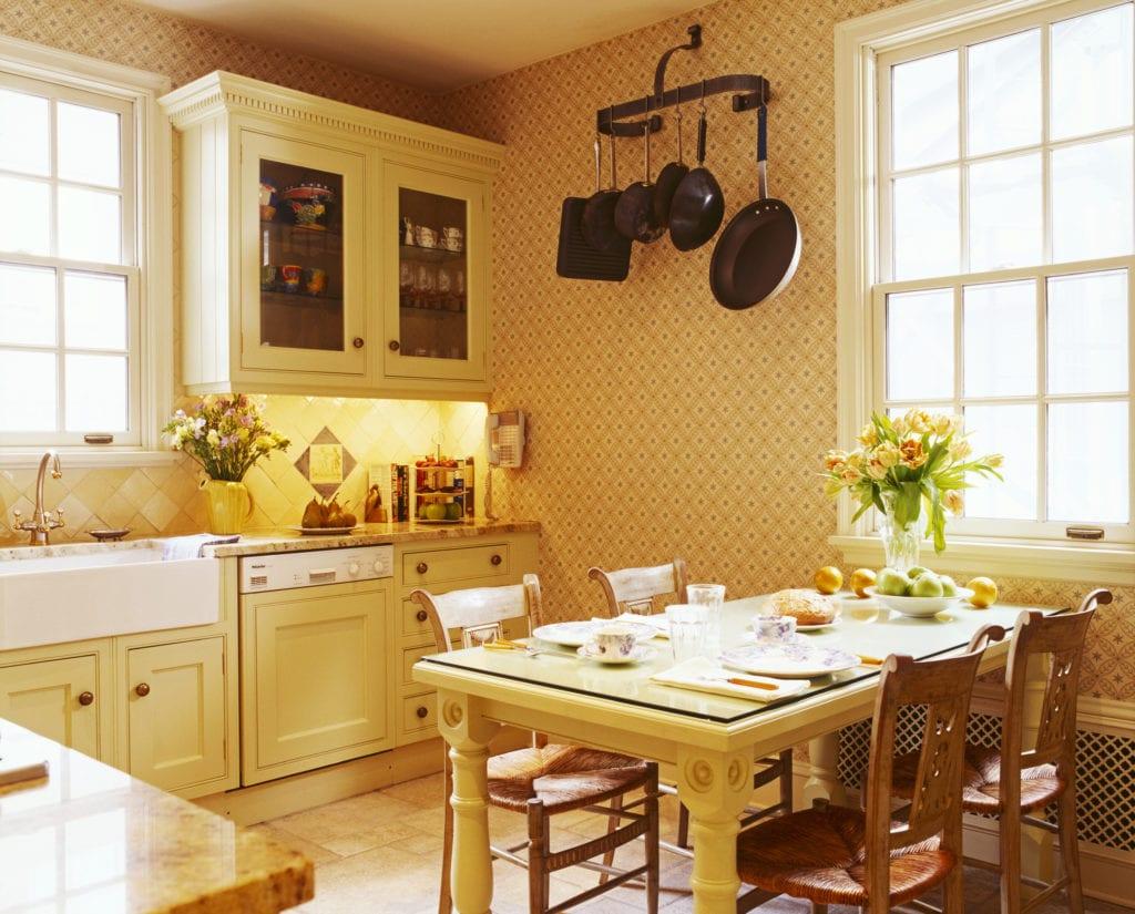 Traditional Country Kitchen with Cane Seat Chairs at Table