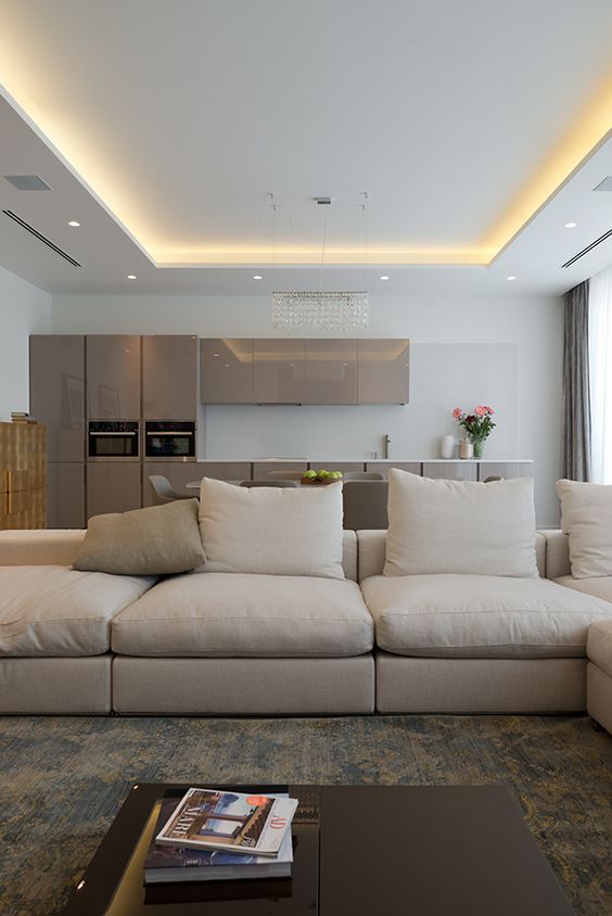 a living room filled with furniture and a large window