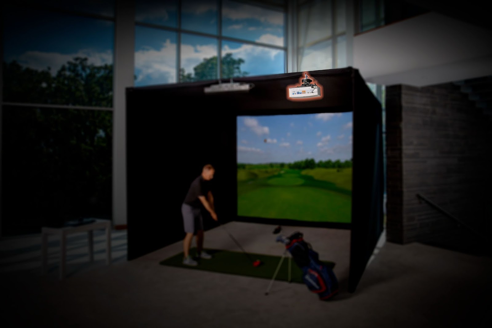 Golf simulator projector mounted on pro enclosure frame