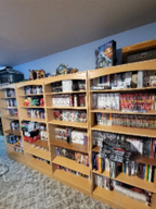 These bookshelves contain some of the author's anime and manga geek presents 