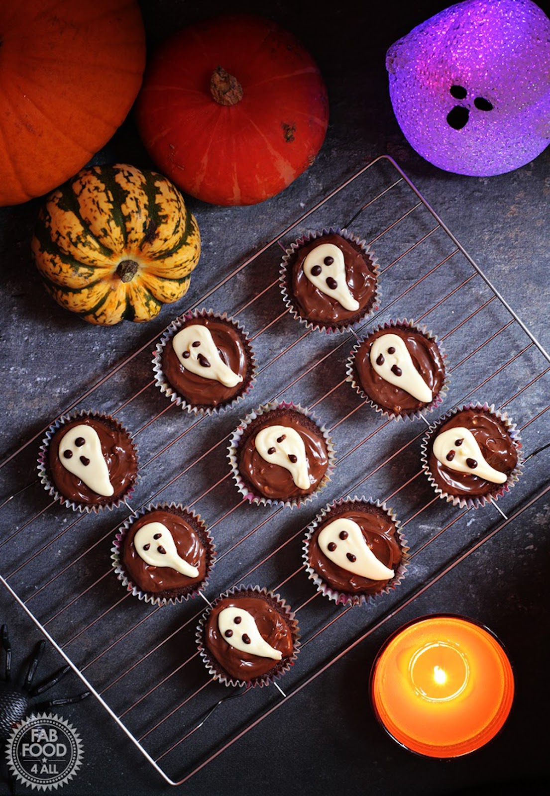 Cupcakes designed with a ghost icing on top.