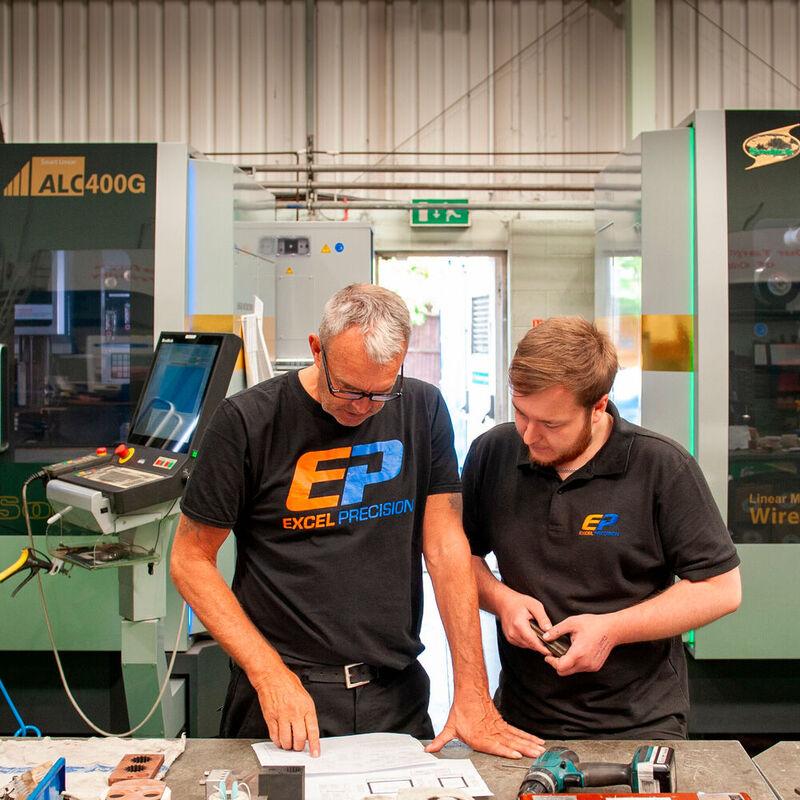(left) Craig Turl Excel Precision Senior Wire EDM programmer with (right) Lewis Andrews Excel Precision Branch Manager with Sodick technology