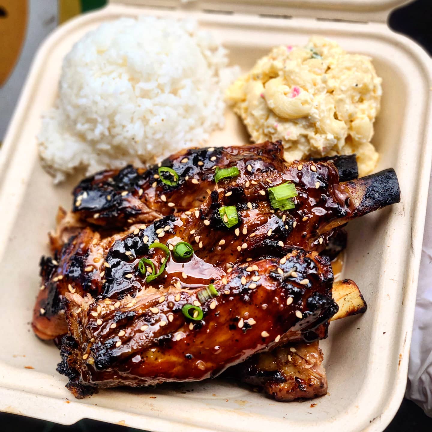 Hawaiian-style ribs served with rice and macaroni salad, a specialty at Kealoha's BBQ.