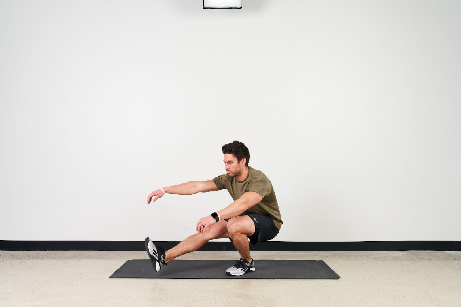 a man doing pistol squats