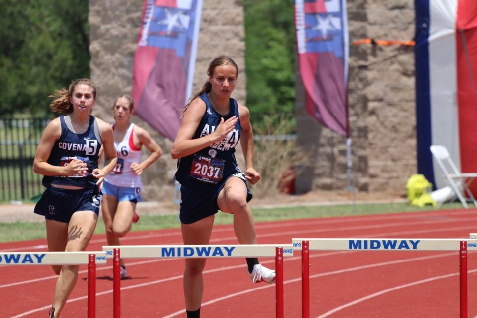 A group of women running on a track

Description automatically generated with medium confidence