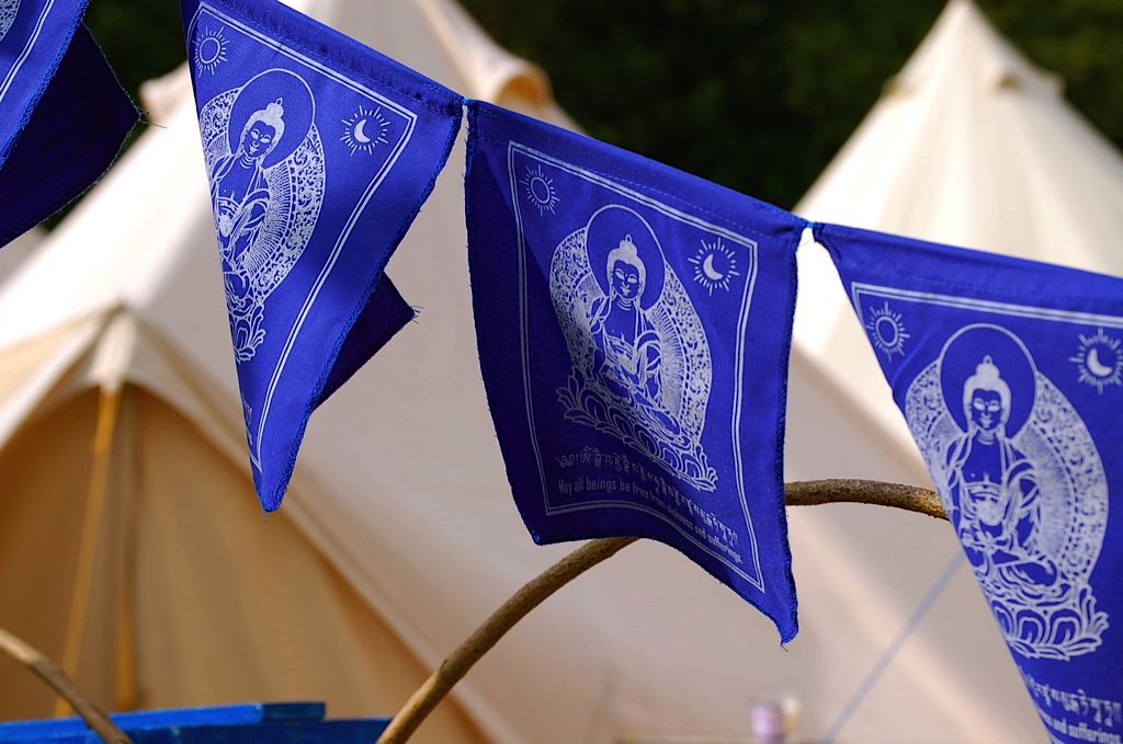 bell tents and blue flags