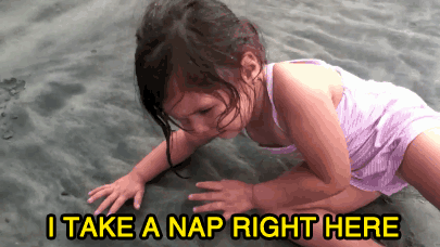 Little girl lying down saying "I take nap here."