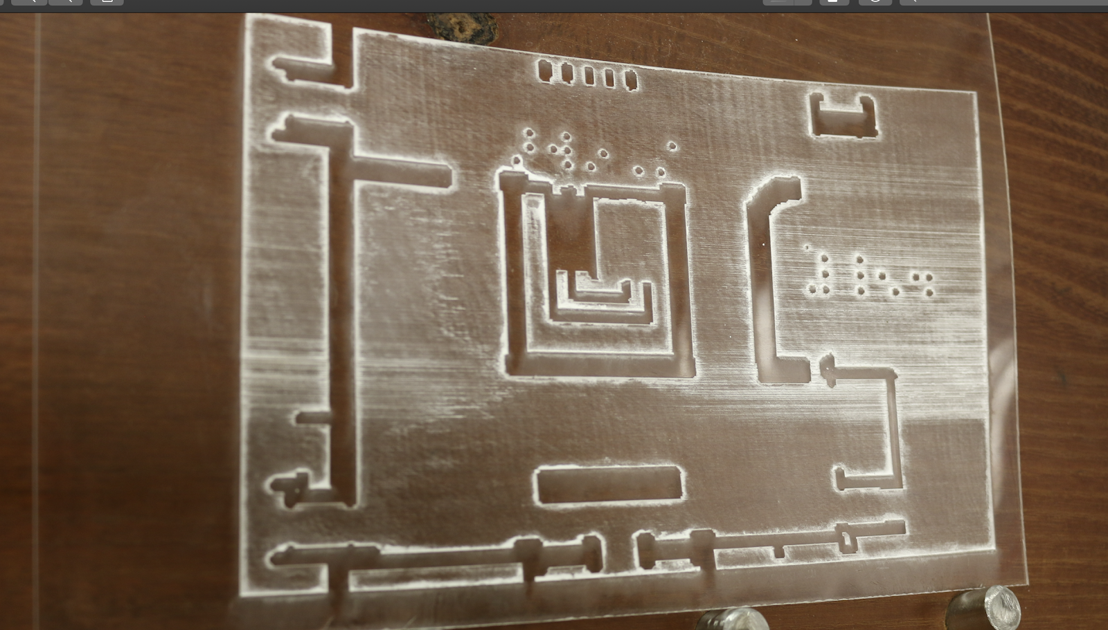 raised braille on acrylic - this acrylic was too thin and warped slightly as can be seen in the image