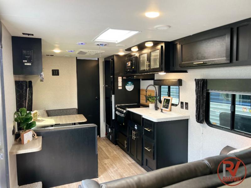 The luxurious black cabinetry gives this RV a modern feel.