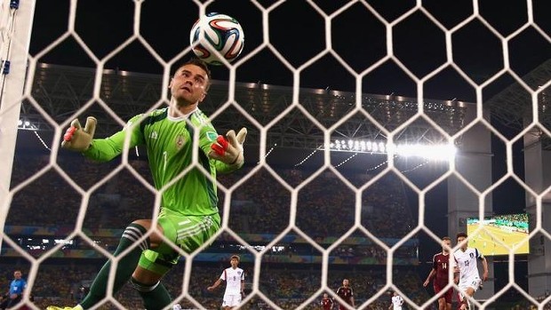 Horror gaffe: Igor Akinfeev of Russia fails to save a shot by Lee Keun-Ho.