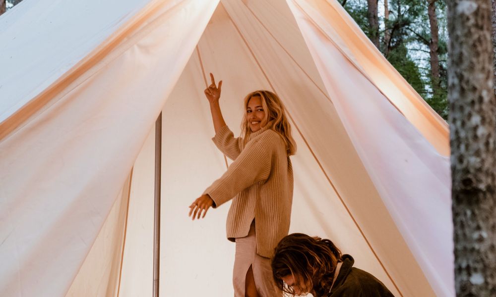 Best Tall Tent, Woman standing in a tall tent, man sitting down