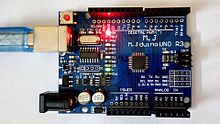 Arduino compatible board with attached power LED and an overall pinout diagram.