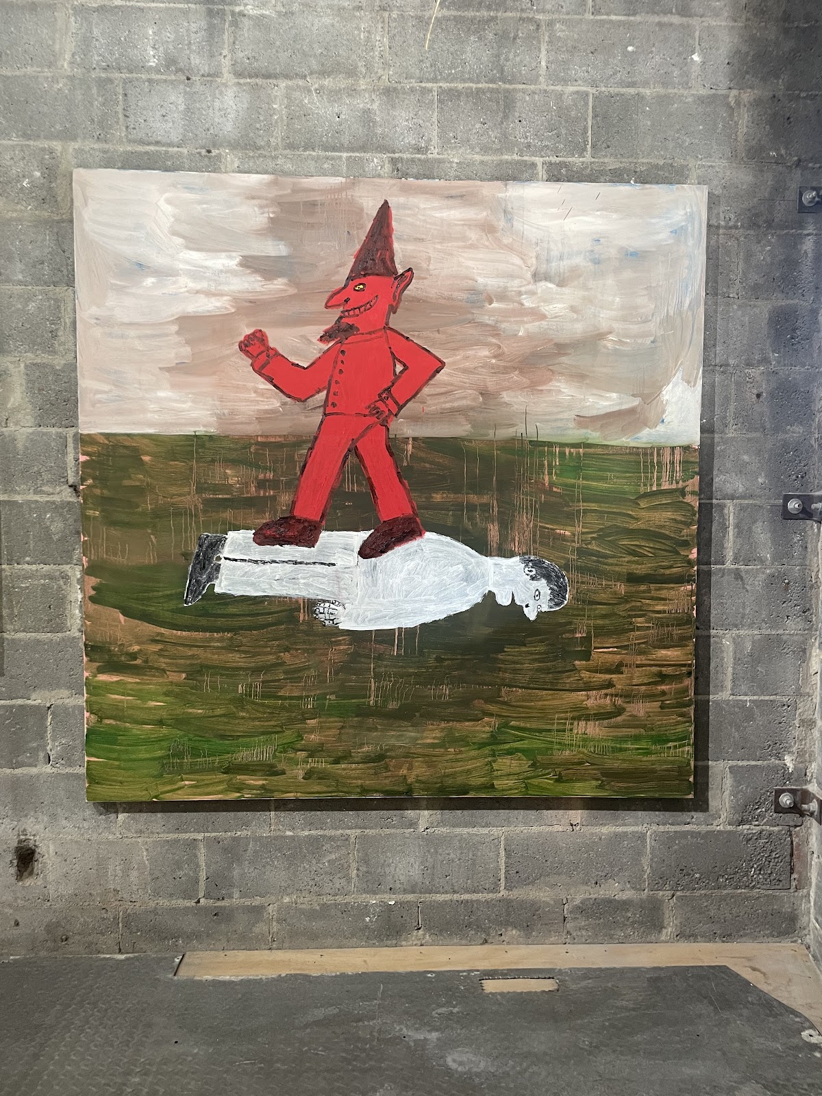 An oil painting of a grinning red devil standing on top of a man laying face down in grass.