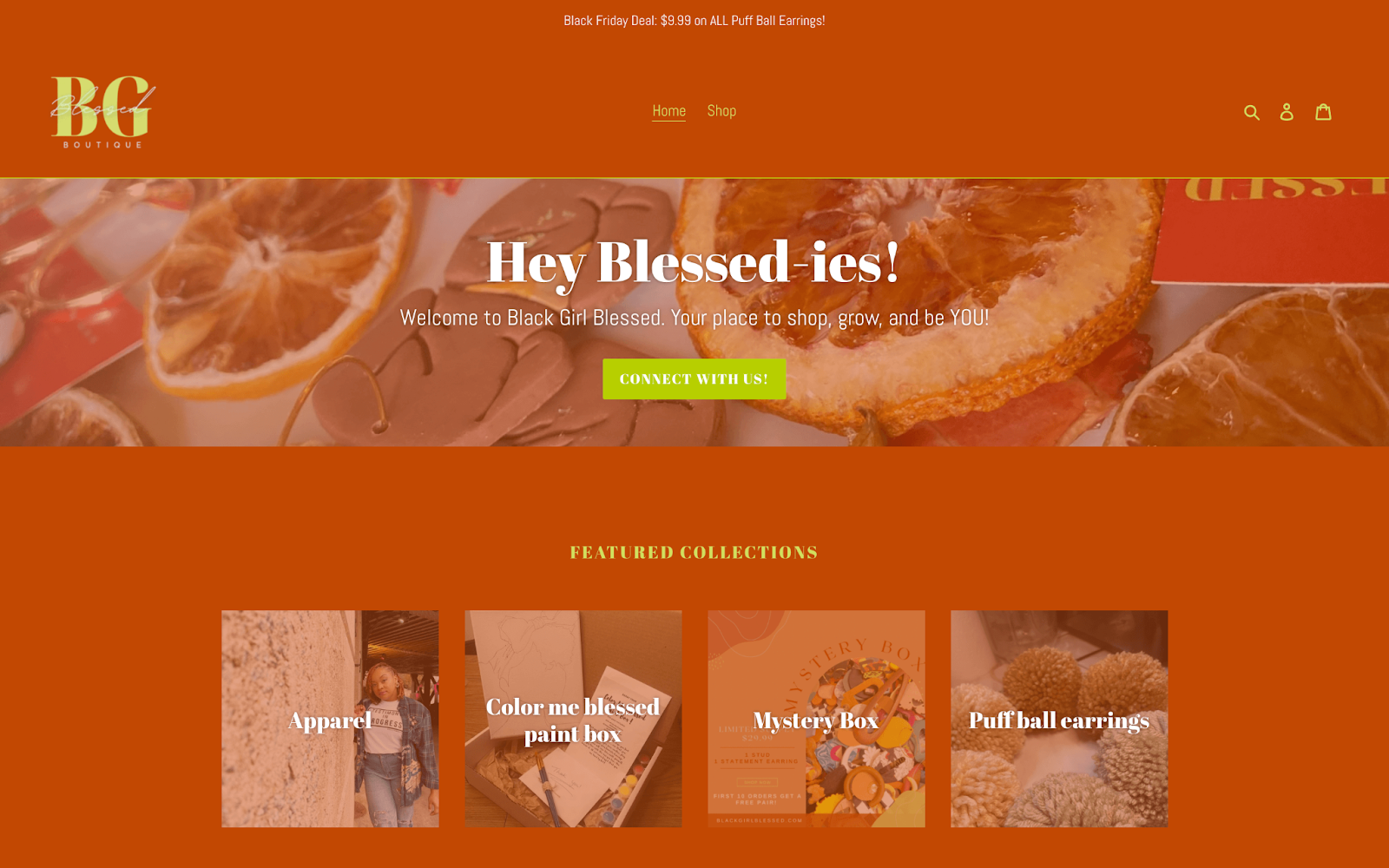 Support Black-owned businesses–A screenshot of Black Girl Blessed’s homepage with a header reading “Hey Blessed-ies!” and photos of their featured collections” Apparel, Color me blessed paint box, Mystery Box, and Puff ball earrings. 