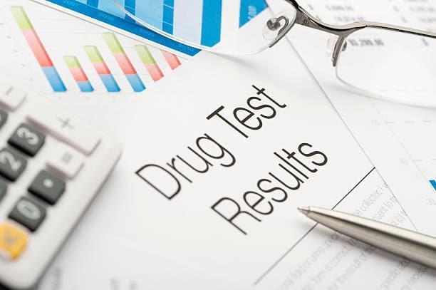 Drug test results Drug test results with paperwork drug test stock pictures, royalty-free photos & images