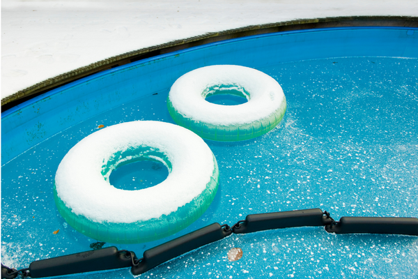 pool floats in a swimming pool covered in snow