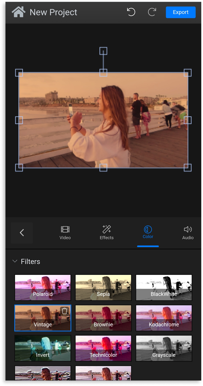 A screenshot of the 'vintage' filter being applied to a vacation video in Flixier.