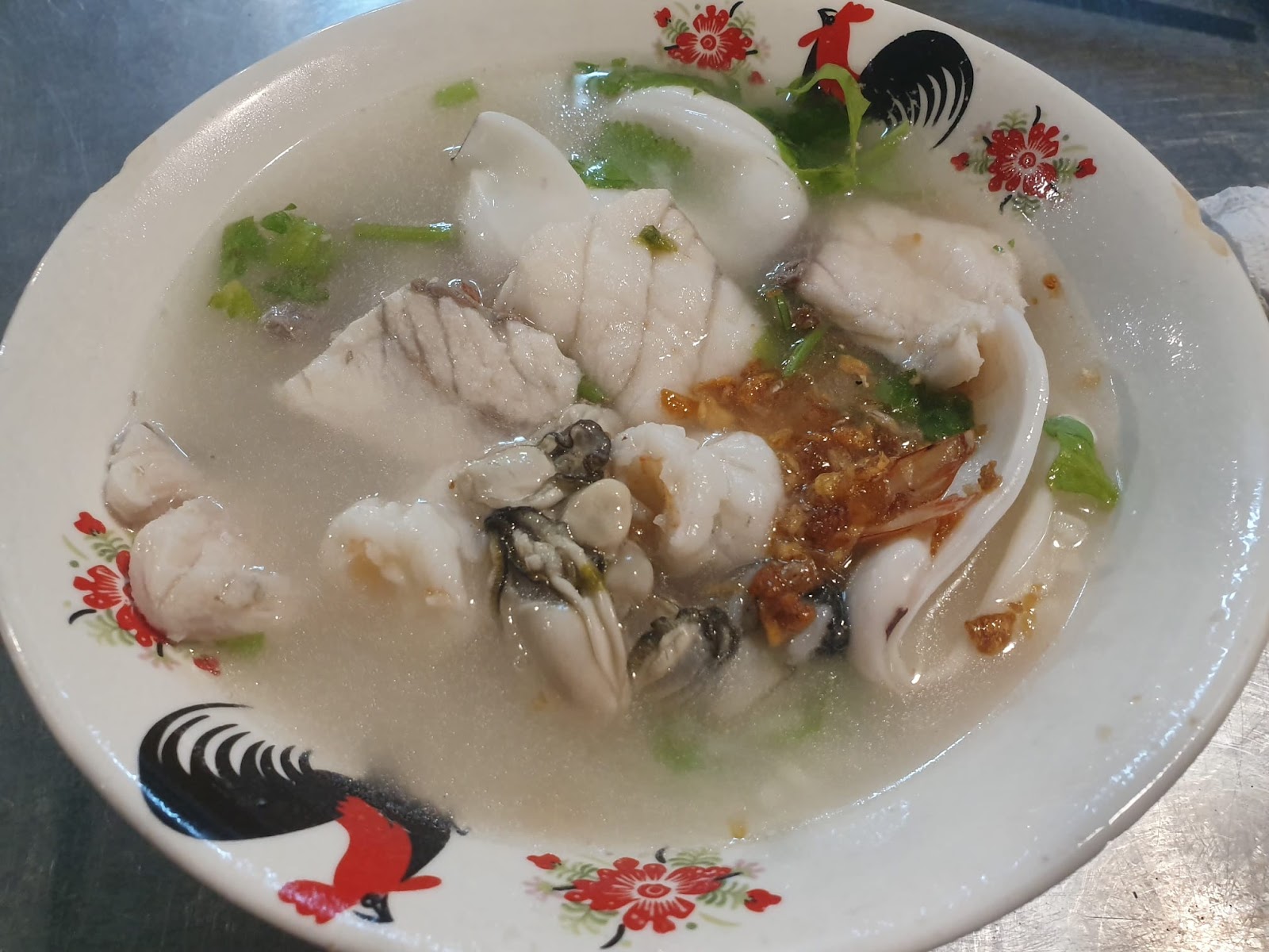 seafood congee with oysters, white snapper, and shrimp