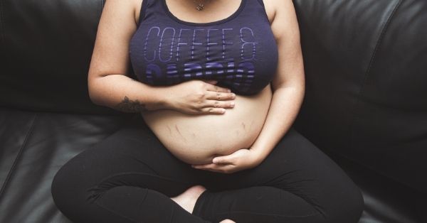 stomach bulging on one side during pregnancy