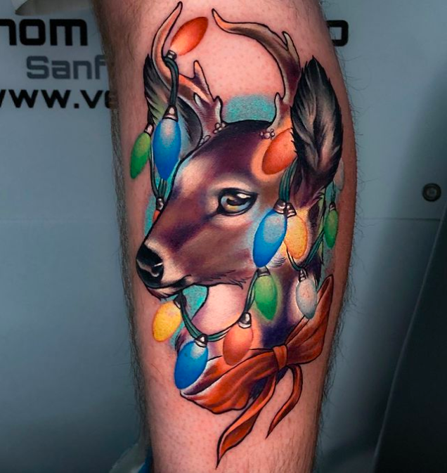 Reindeer's Face In Christmas Lights Tattoo