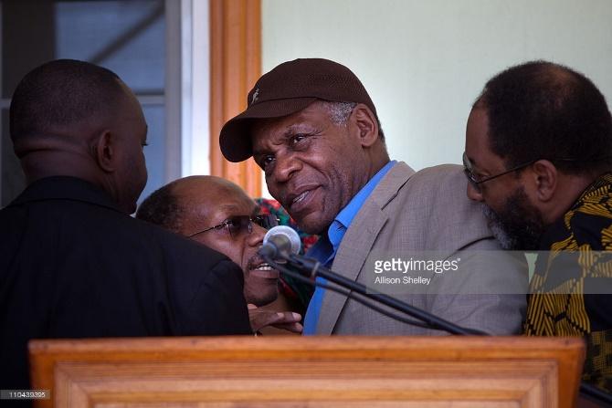 http://media.gettyimages.com/photos/former-haitian-president-jeanbertrand-aristide-confers-with-actor-picture-id110439395