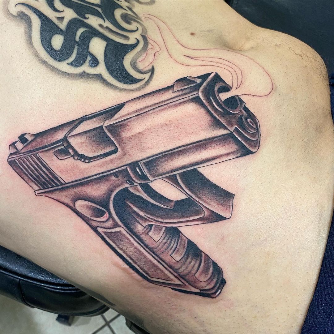 Gun Smoke Tattoo On Waist