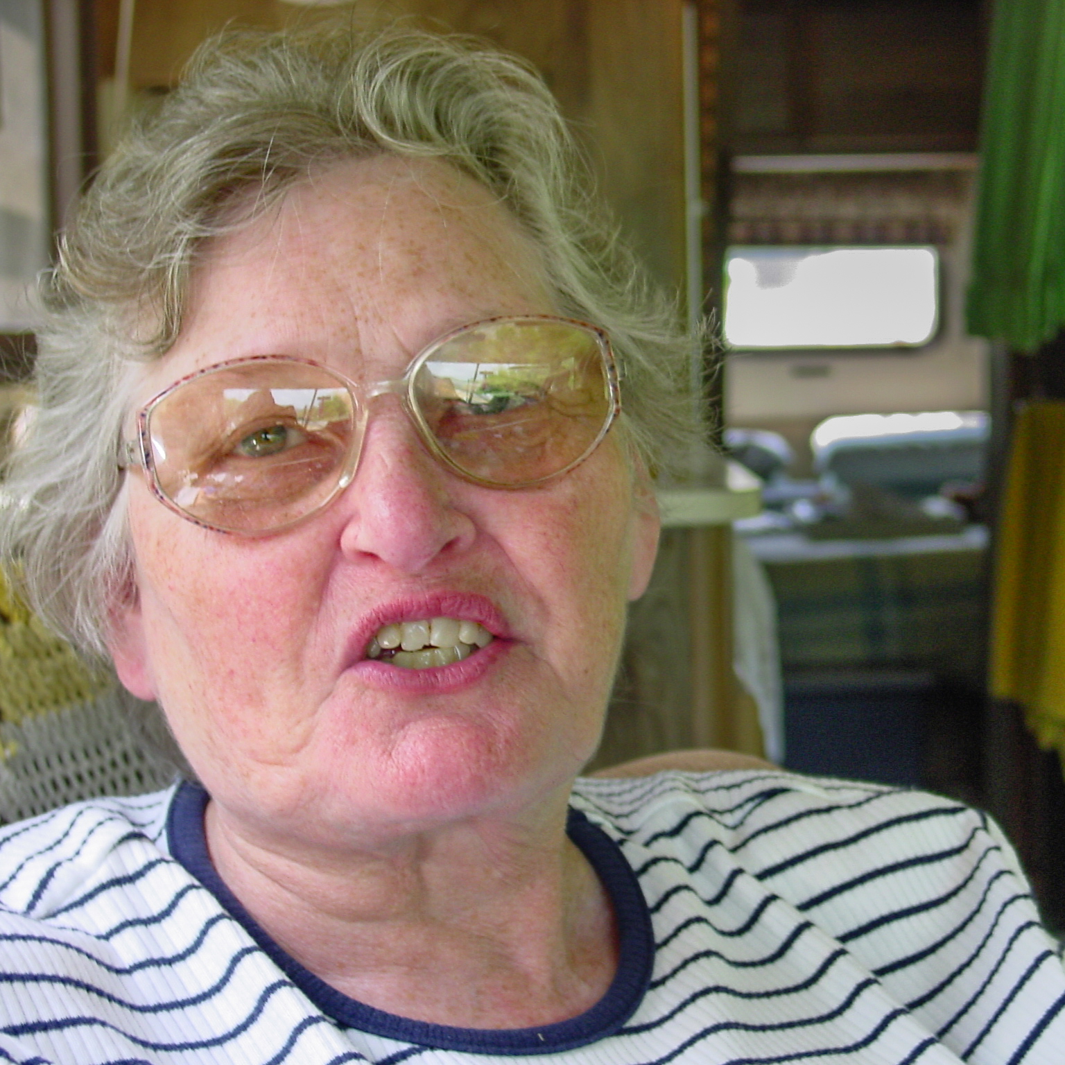 Woman with glasses talking