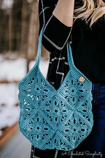 woman carrying a blue floral tote