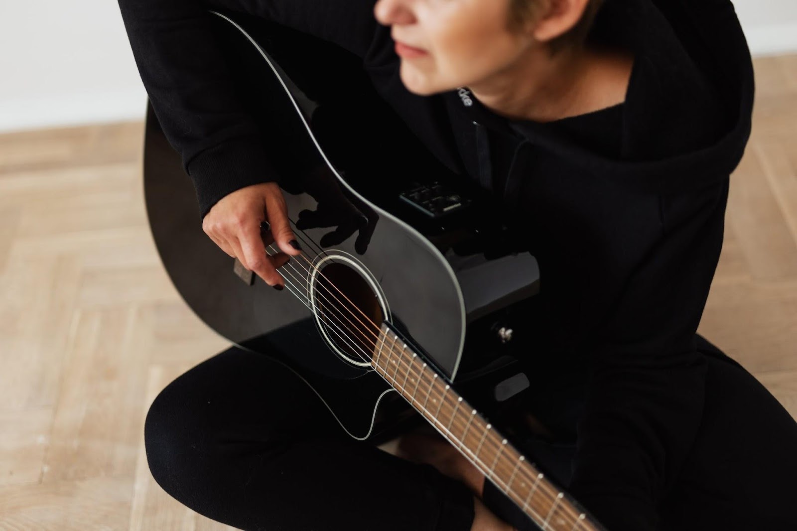 improve your mental health woman playing guitar