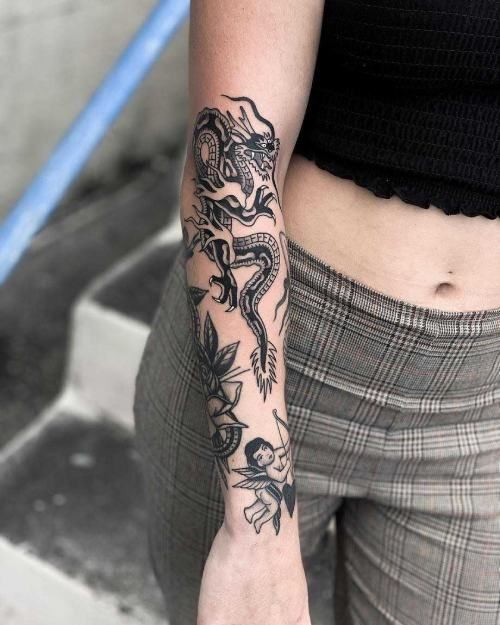 lady wearing dragon half tattoo sleeve