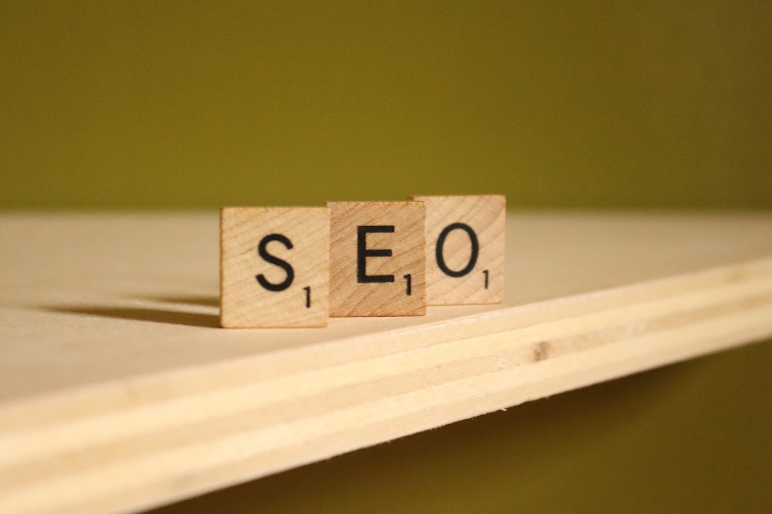 SEO (Search Engine Optimization) spelled out in Scrabble tiles | North Branch Copywriting Co.