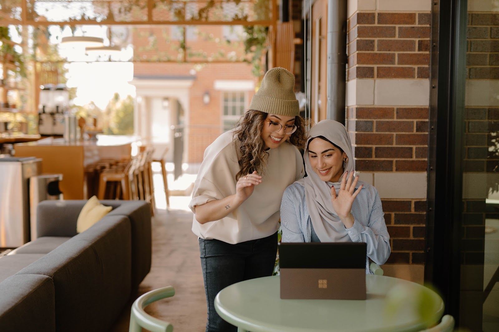 Two women talking about their recent success.