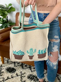 woman holding a tote with plants