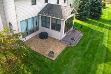 home addition with patio and outdoor living space yard custom built michigan