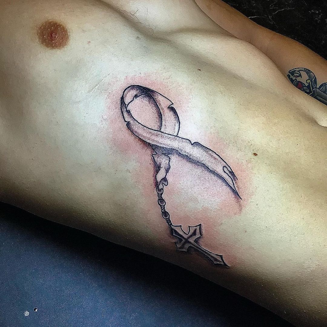 Ribbon and Cross Tattoo On Rib