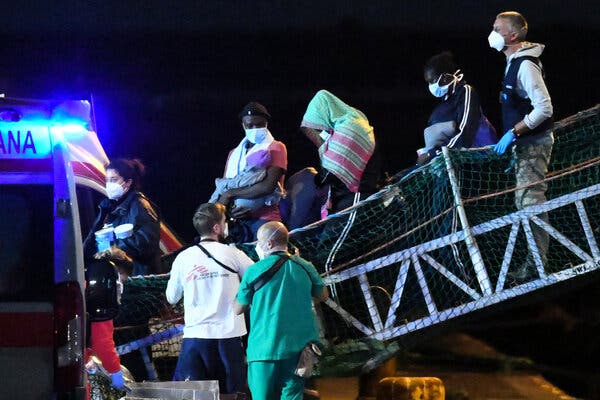 Migrants disembarked on Sunday from the Geo Barents rescue ship in the port of Catania, Italy. More than 200 were kept on board by the Italian authorities. 