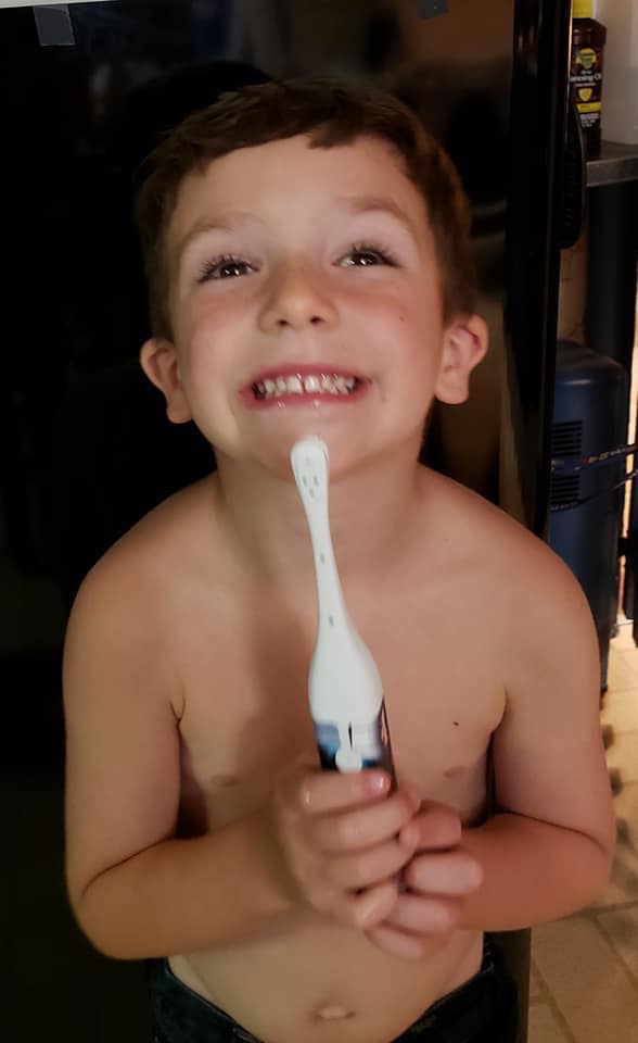 Image may contain: 1 person, smiling, child and closeup