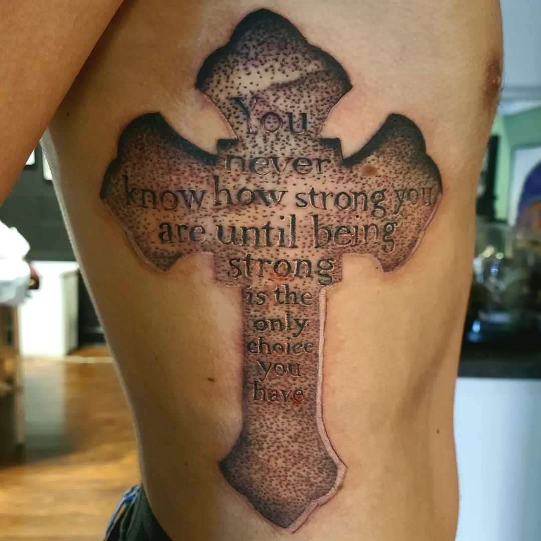 Wording And Cross Tattoo On Rib