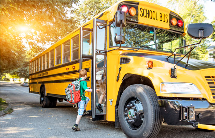 Children getting on a school bus in Asheville