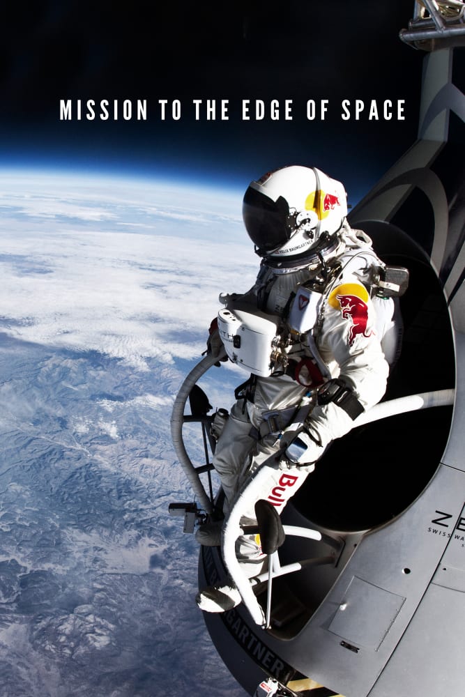 A photo of Felix Baumgartner in a space suit, standing on the edge of his shuttle. The rounded curve of the Earth is behind him as he prepares to jump.