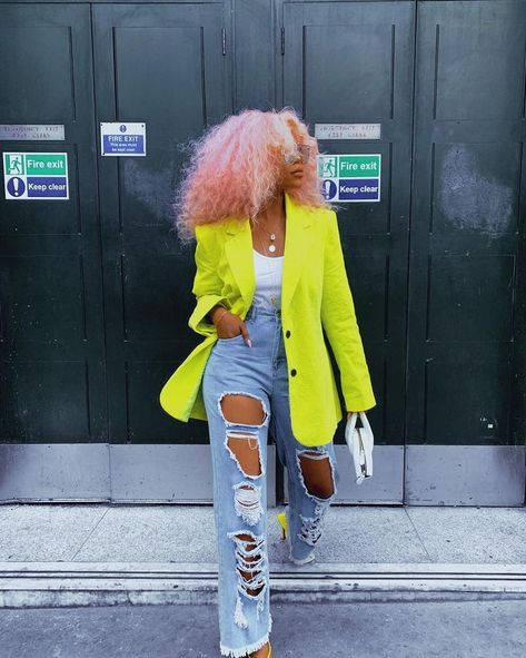lady wearing top and ripped jeans with yellow jacket and other fashion accessories