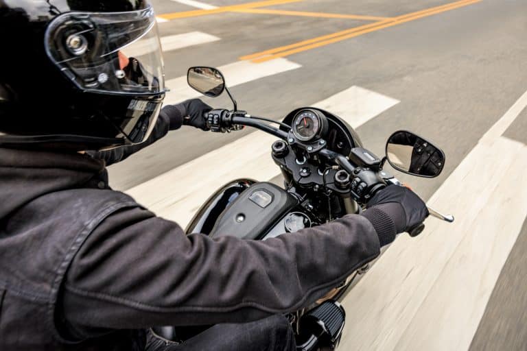 See the road from a new perspective with a first-person view of a rider on a Harley Davidson cruiser