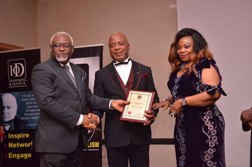1. L-R Mr Femi Akeju, President and Chairman, Board of Governing Council IOD, Emperor Chris Baywood Ibe, Preident, Baywood Continental; and Empress Pat Baywood Ibe at the presentation of Institute of Directors' Fellow Award Held recently in Lagos.jpg